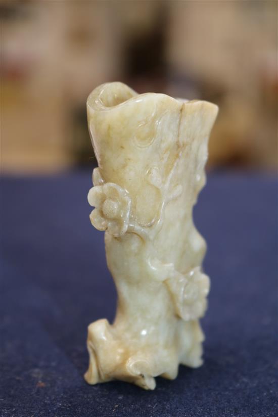 A Chinese jade snuff bottle and a Chinese jade prunus trunk-shaped vase